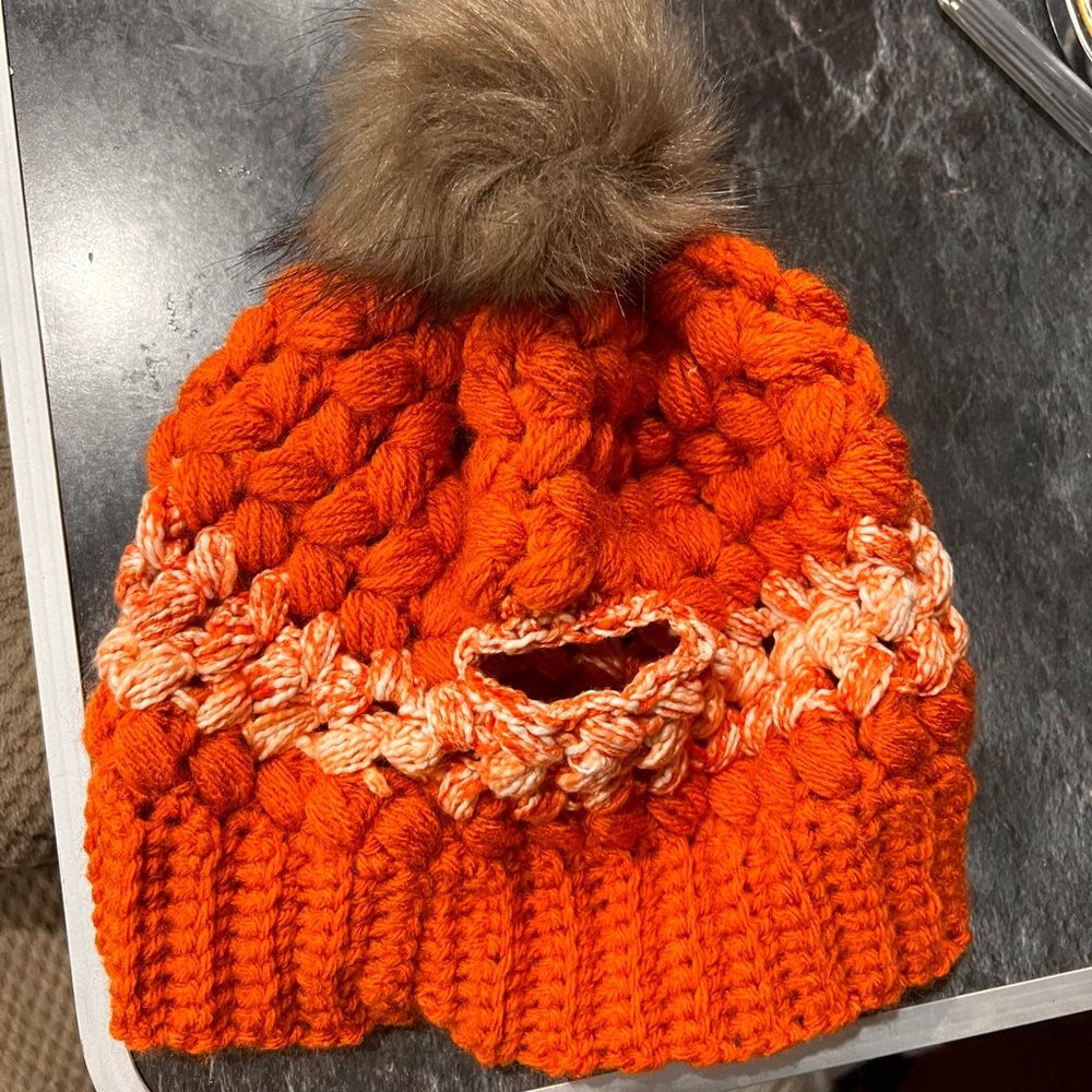 Handmade crochet beenie with removable pompom and back ponytail area